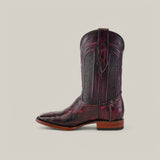 A single Exotic American Alligator Belly boot in Black Cherry with a square toe is shown in profile against a plain grey background. It features intricate stitching, a textured design, and a low wooden heel, perfect for any occasion.