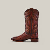 The Exotic American Alligator Herradura Brandy boot features a square toe, crafted from genuine alligator leather with intricate patterns and a textured design. It is displayed against a plain background.