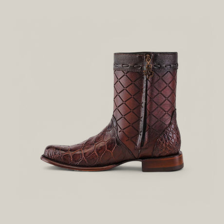 The Exotic American Alligator - Europe Brown - Round Toe boot boasts a textured, geometric pattern with reptile-like scales on the toe and heel, reminiscent of premium alligator leather. Handcrafted and featuring a side zipper and low wooden heel, it stands out against a plain grey background.