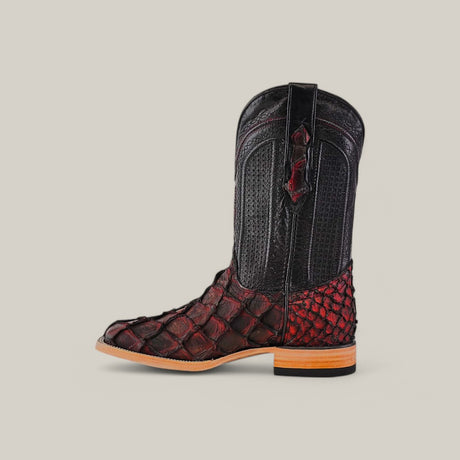 The Exotic Pirarucu Fish - Red - Square Toe cowboy boot boasts a smooth upper and dark red scaly pattern resembling Pirarucu fish on the lower part, complete with a wooden heel and side pull tab, all against a plain light backdrop.