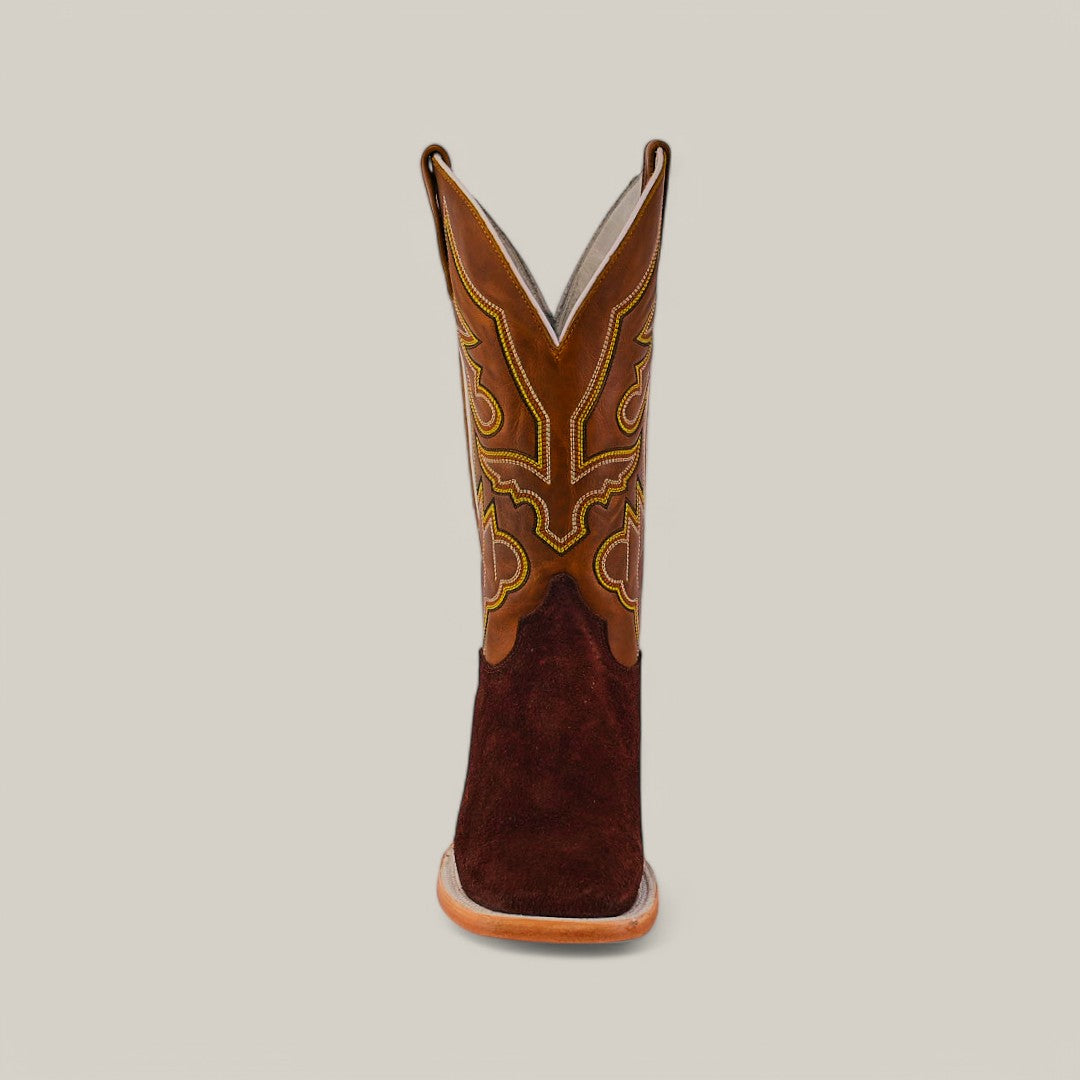 Front view of a Brown Suede - Platinum boot, featuring a square toe, crafted with rich brown leather and detailed stitching on the shaft against a plain grey background.