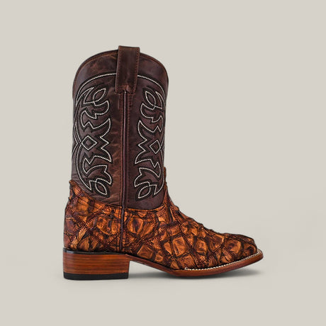 The Exotic Patchwork Pirarucu Fish - Matte Brown - Square Toe boot features a brown leather upper, white stitching, and a textured tan-brown lower section, displayed on a neutral background—a luxurious footwear statement.