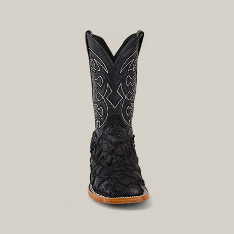 The Exotic Patchwork Pirarucu Fish - Matte Black - Square Toe boot features intricate shaft stitching and textured pirarucu leather on the foot, displayed facing forward on a plain light gray background.