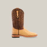 The Exotic Full Quilt Ostrich - Orix - Square Toe boot features a tan ostrich leather foot with a dark brown, intricately stitched shaft, complete with pull tabs and a wooden heel.