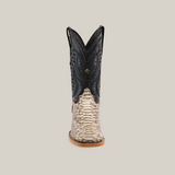 Front view of the Exotic Python - Natural - Square Toe cowboy boot features a black leather upper, python-textured lower, intricate stitching on the shaft, a square toe, and a light brown sole. This striking Western fashion icon stands proudly against a neutral background.