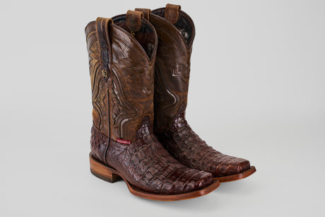 A pair of Exotic Caiman Hornback - Brown - Rodeo Toe boots with detailed shaft stitching and textured, genuine caiman leather on the foot, displayed side by side on a plain light background.