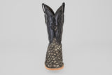 The Exotic Pirarucu Fish - Newspaper - Square Toe boot features a scale-textured exotic leather lower, smooth black upper shaft with decorative stitching, and a tan sole, shown front-facing against a plain light background.
