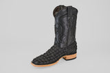The Exotic Pirarucu Fish - Matte Black - Square Toe features a scale-textured foot, smooth stitched leather upper, and is finished with a light tan sole and wooden heel for a bold, elegant look.