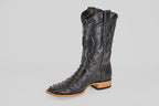 The Austin - Black - Square Toe cowboy boot features black Avestruz leather with decorative stitching, a textured finish, and a light brown wooden heel and sole, showcased against a plain light gray background.