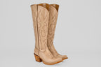 The Allison Cream Tall Shaft cowboy boots for women feature tan leather, decorative stitching, snip toes, and angled wooden heels, showcased on a plain white background.