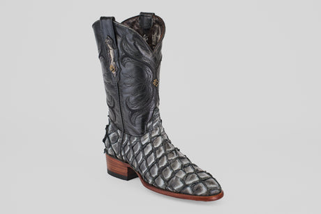 The Conor - Newspaper - Roper Toe is a unique boot with a black stitched upper, scaly pirarucu-style lower, and brown stacked heel—ideal for those seeking standout exotic roper toe boots.