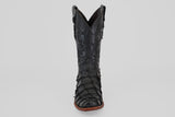 The Conor - Matte Black - Narrow Square Toe cowboy boot features textured, patterned fish leather and a brown sole, displayed upright and facing forward on a plain light gray background.