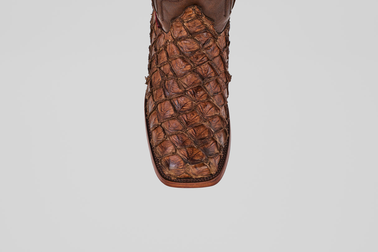 Close-up of the toe of the Conor - Brown - Rodeo Toe boot, featuring a textured, scale-like pattern resembling exotic leather, shown against a plain white background.