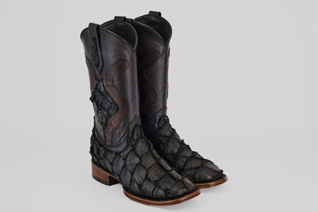 A pair of Conor Platinum - Matte Black - Square Toe (Diamond) boots with a textured, scale-like finish and brown wooden heels, displayed side by side on a light gray background.