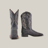 A pair of Cheyenne Black - Square Toe boots made from premium cowhide, showcased with one boot upright and the other on its side to display the heel and sole against a pristine white background, featuring intricate stitching.