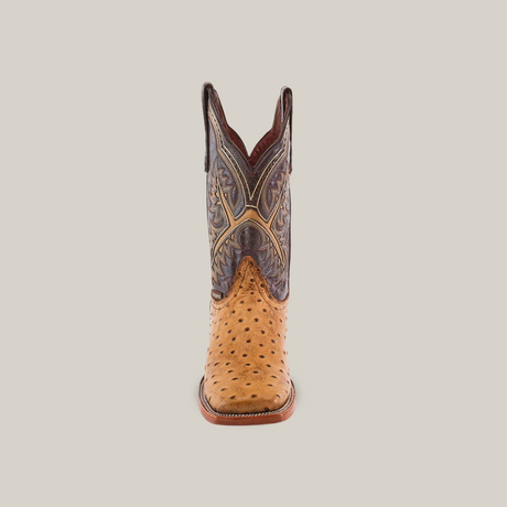 The Karoo Ostrich Print Orix - Square Toe cowboy boot features a textured tan leather foot with a square toe and an intricately patterned dark brown shaft, showcasing high-quality cowhide craftsmanship against a plain white background.