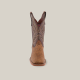 Front view of the Lizard Print Tabaco - Square Toe cowboy boot showcasing intricate stitching. This handmade brown boot features a textured lizard print foot and detailed designs on the square toe upper shaft, set against a plain white background.