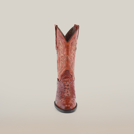 The handcrafted Karoo Ostrich Print Cogñac boot, with decorative stitching and a round toe, stands upright against a plain white background.