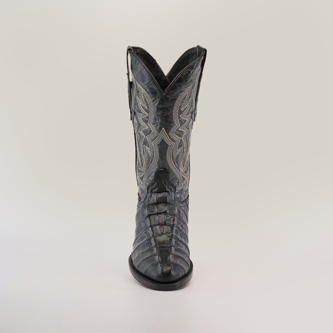 A single Crocodile Tail Print Black - Round Toe cowboy boot in dark cowhide leather with intricate stitching is displayed on a plain white background, featuring stylish detailing with a round toe and tall shaft.