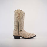 This handcrafted Karoo Ostrich Print Bone boot features a light tan leather upper with intricate stitched patterns and an ostrich print foot. It has a dark brown leather sole and heel, providing a striking contrast to the light finish.