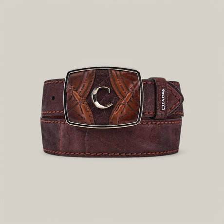 The Brown Elephant Laser Belt - BC345 is made of premium leather, showcasing detailed stitching and a large rectangular brass buckle with a crescent moon motif. It elegantly rests coiled on a light gray background.