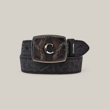 The Black Elephant Laser Belt - BC346 is a black leather belt featuring a silver, laser-engraved buckle with a decorative pattern and central C emblem. It is made from premium materials with a visible Chukar tag, all on a light gray backdrop to enhance its elegance.