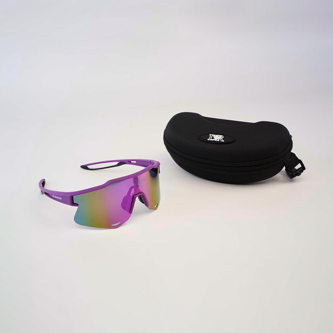 Resting on a white surface next to a black zippered case with a white logo, the DR Sport Sunglasses Grape are fashionable with UV protection and gradient-tinted lenses. Their sleek design makes them both stylish and functional for any adventure.