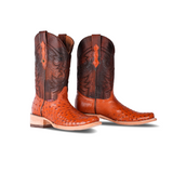 Pair of handcrafted cowboy boots with a tan ostrich leather vamp and dark brown shaft featuring intricate embroidery, displayed against a white background