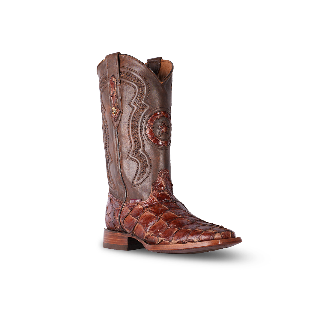 Handcrafted cowboy boot made of brown exotic leather with a textured vamp, detailed stitching, and a Western star emblem on the shaft, displayed against a white background