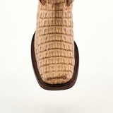 Close-up of the Exotic Caiman Hornback - Orix boot with a textured pattern and squared Rodeo toe. Crafted from premium leather, it features a light brown hue and dark brown stitching.