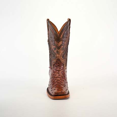 The Exotic Ostrich - Brown - Rodeo Toe boot showcases superior craftsmanship with intricate stitching and patterns on the shaft. The textured design on the toe enhances its artisanal beauty, standing centered on a plain white background.