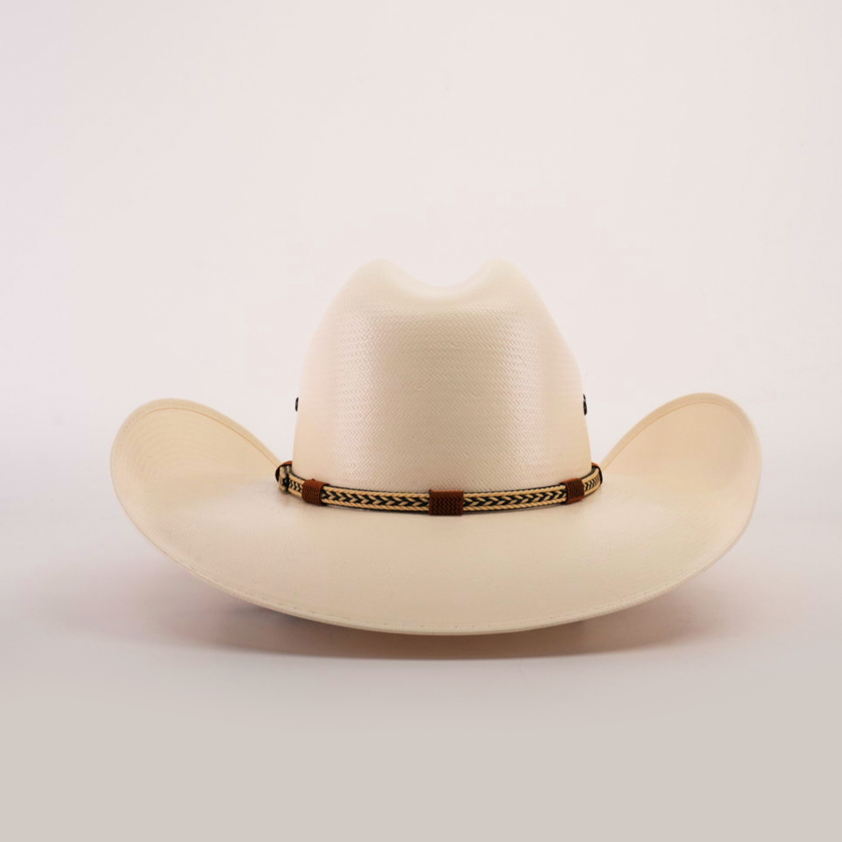 The 500X Chihuahua Straw Hat, in cream color with a wide brim and braided band, showcases style and durability. Artfully positioned against a white background, it highlights timeless elegance.