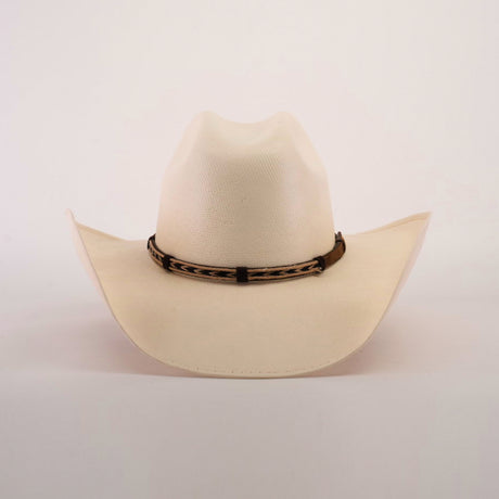 The 5000x Chihuahua Straw Hat, crafted with exquisite craftsmanship, is cream-colored with a curved brim and features a brown leather band with a woven design, beautifully displayed against a plain white background.