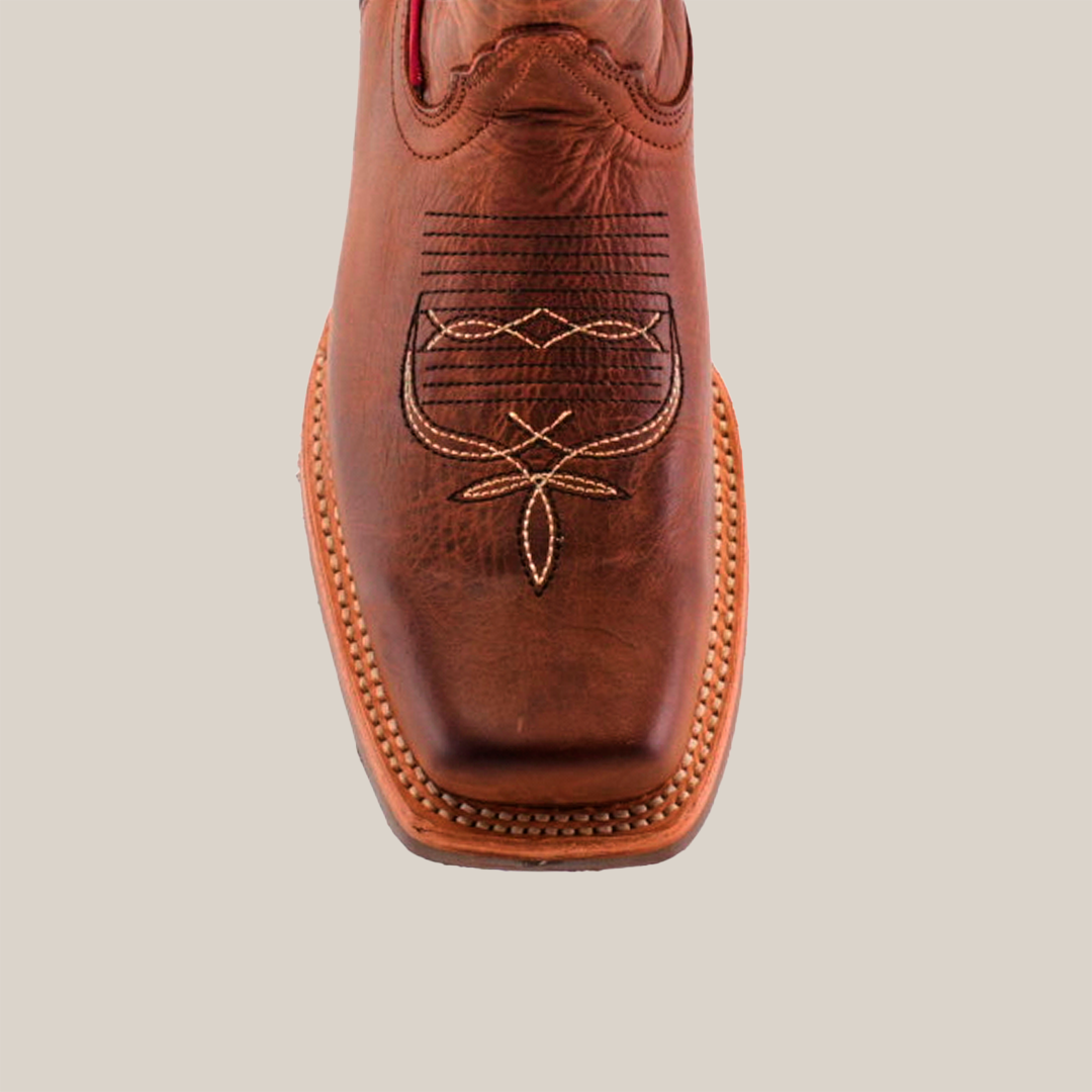 Close-up of a single Fresno Shedron boot in brown cowhide leather with intricate stitching on the toe box, featuring a rodeo toe and slip-resistant sole, all set against a plain white background.