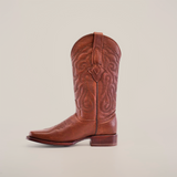 The Grisly Brown - Rodeo Toe boot, crafted from premium cowhide, has decorative stitching on the shaft, a pointed toe, and a low block heel. Its displayed on a plain white background.