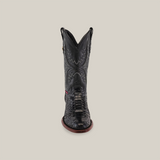 A handcrafted Exotic Python - Black boot with intricate stitching and a textured python pattern on the front. It features a round toe and dark brown sole, set against a light beige background.