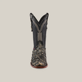 Front view of the Exotic Piraruco Fish boot in Rustic Bone, made from genuine fish leather with a dark upper, detailed stitching, and textured scales. Featuring a brown sole and narrow square toe against a plain light background.