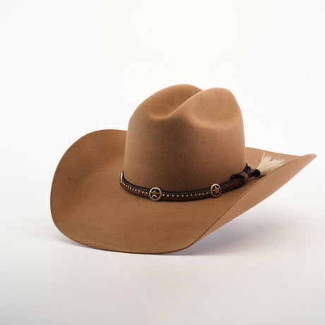 The 6X Doble SS Fawn is a tan cowboy hat made from soft felt, featuring a wide brim, a leather band with star-shaped ornaments, and a small feather, all set against a plain white background.