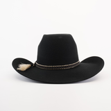 The 6X Brazil Black cowboy hat features a wide brim, crafted from Brazilian felt sheep wool, and is accented with a braided band and tassel, capturing Western heritage against a plain white background.