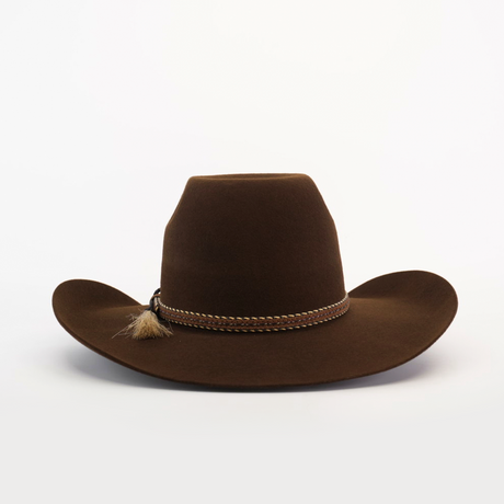 The 6X Brazil Brown cowboy hat features a wide brim and a braided band with a tassel, crafted from premium Brazilian felt, on a plain white background.