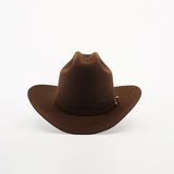 The 6X 2 Carnales Brown felt hat, crafted from high-quality sheep wool, features a wide brim and a slightly curved peak. It showcases the classic western style elegantly against a plain white background.