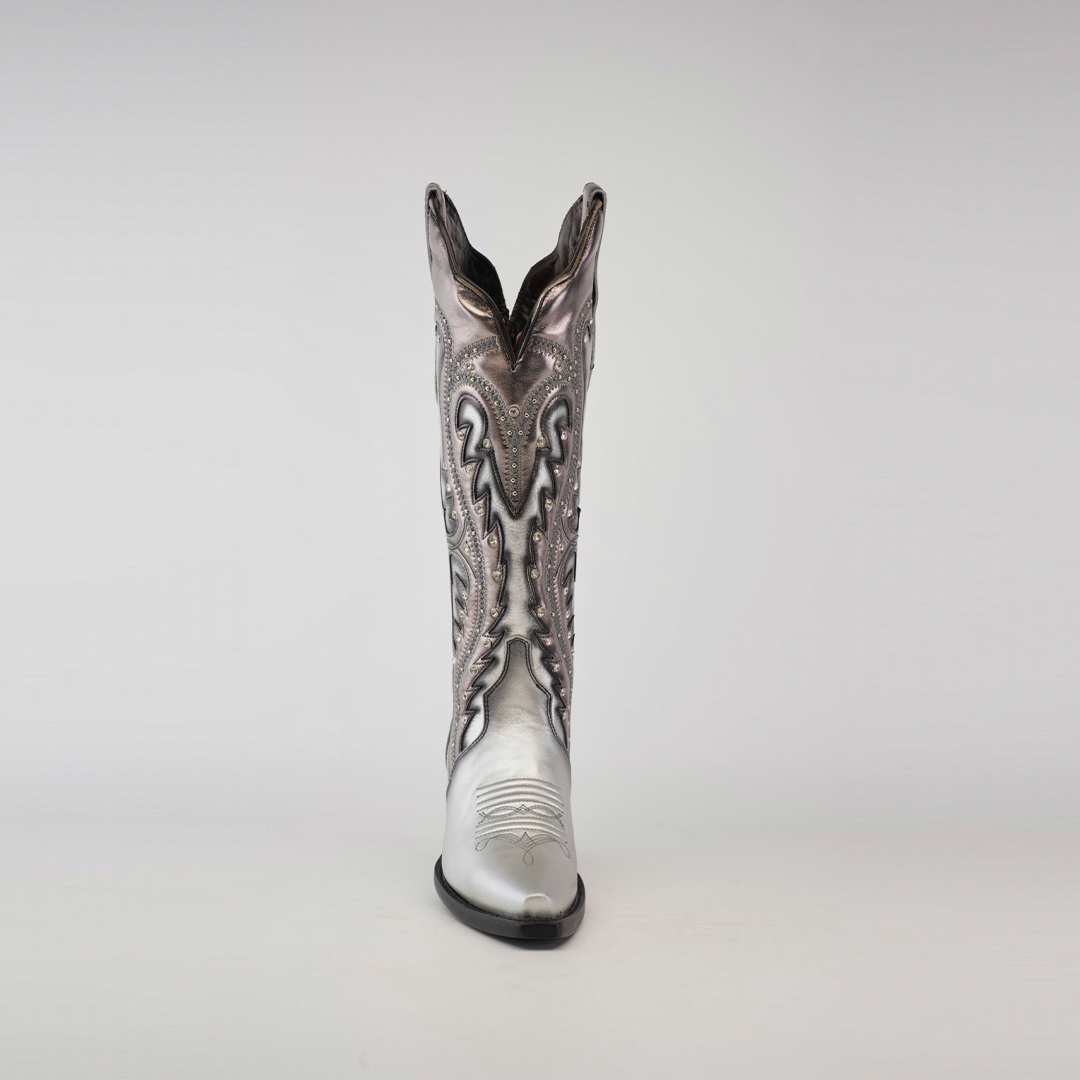 Displayed on a plain white background is a single Valentina Silver - Tall Shaft - Snip Toe cowboy boot. Crafted from premium leather, it boasts intricate black and white patterns with symmetrical swirling lines and decorative stitching, embodying elegance.