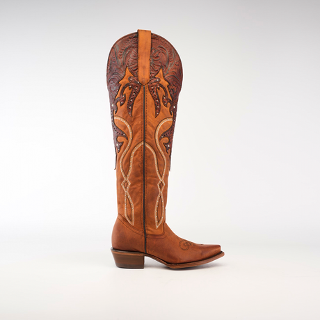 The Miriam Brick - Tall Shaft - Snip Toe is a womens tall, brown leather cowboy boot crafted from premium materials with intricate decorative stitching and a detailed embossed pattern at the top. It features a low heel and slightly pointed toe, displayed on a plain white background.