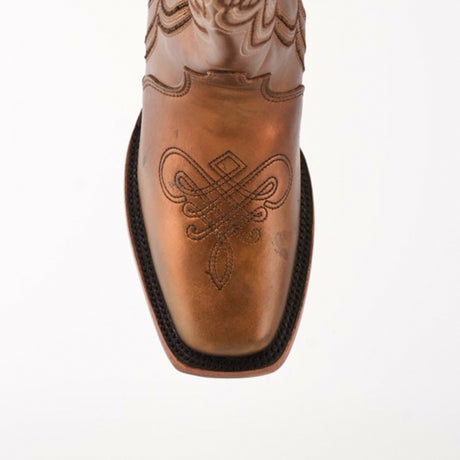 Close-up of the Eden Copper - Tall Shaft - Narrow Square Toe boot in premium leather, featuring luxury craftsmanship. The brown boot displays intricate square toe stitching in a symmetrical pattern, elegantly highlighted against a plain white background.