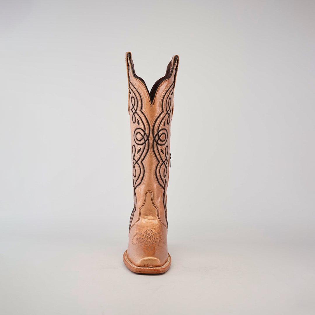 A single cowboy boot from the Eden Rose Gold collection stands upright against a plain background, featuring intricate dark stitching on its light tan leather with a smooth finish. The tall shaft and narrow square toe add elegance to this striking piece.