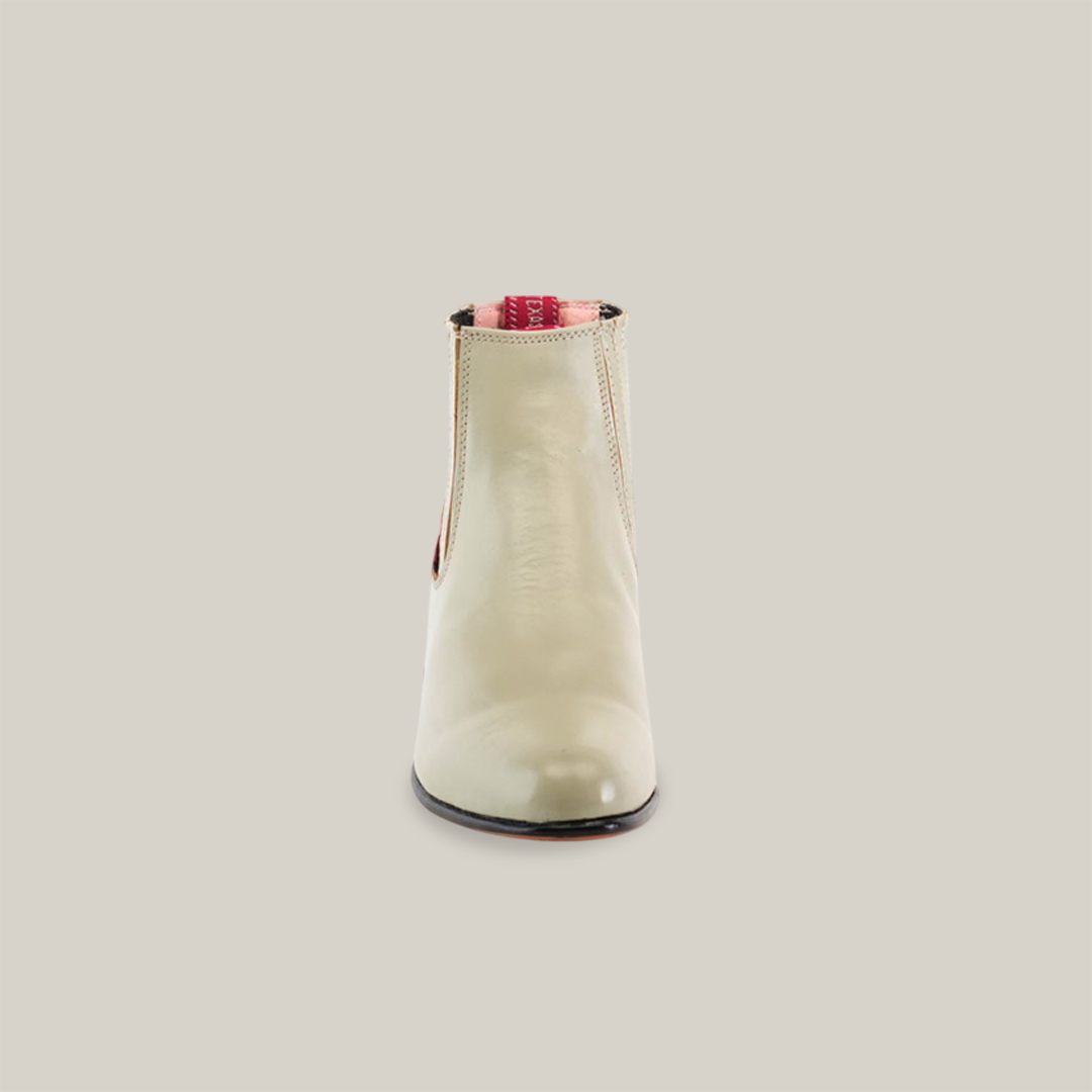 Front view of the Napa Bone - Round Toe boot against a white backdrop. This handcrafted ankle boot features a minimalist design, elastic side panels, and a rounded toe with red lining inside—ideal for any western wear collection.