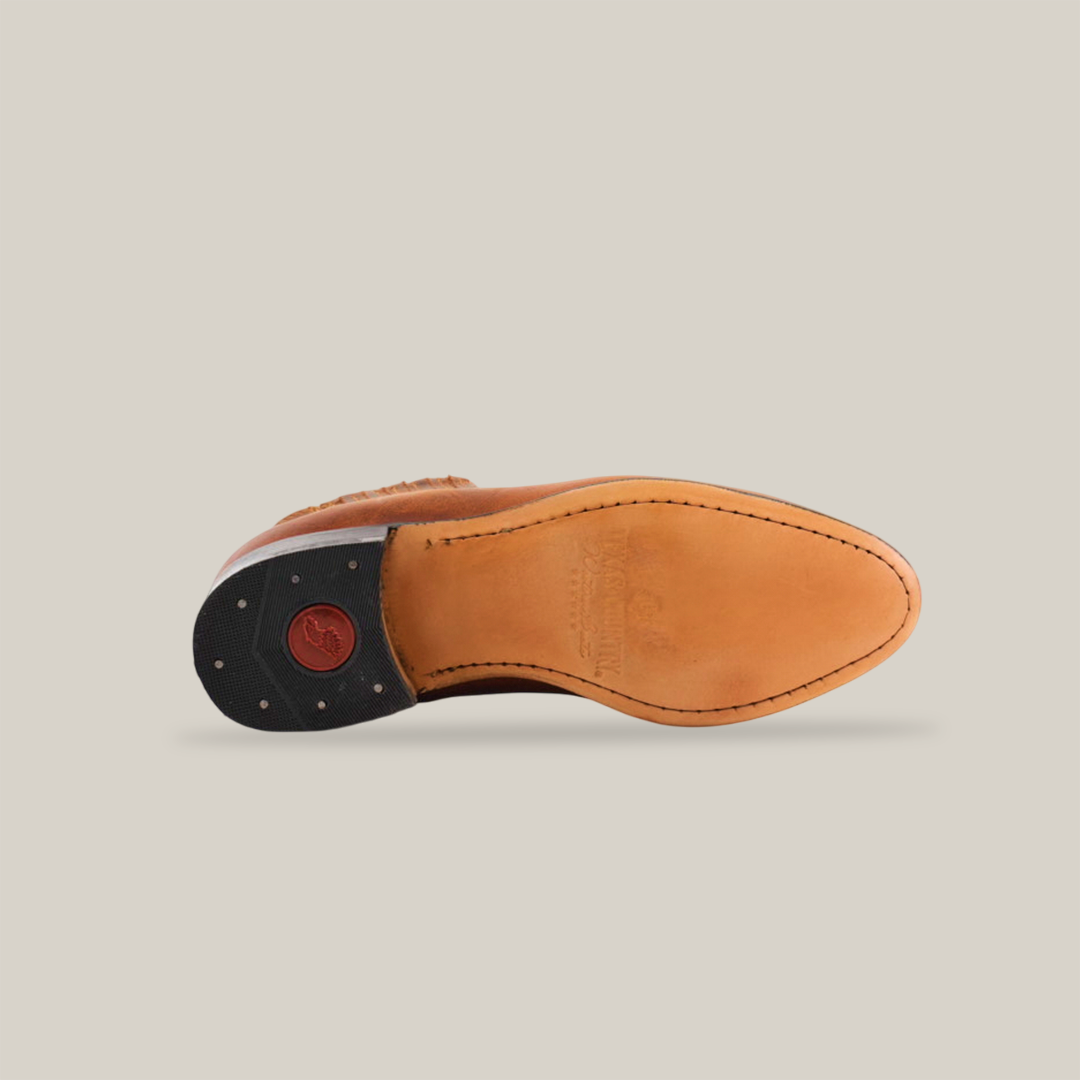 The Avejentado Honey - Round Toe features brown leather with visible stitching and a black and red heel cap, evoking western footwear style against a white background.