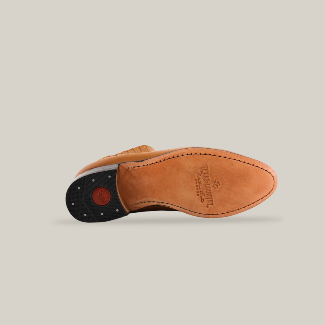 The image displays the sole of a Grasso Honey - Round Toe shoe in premium leather. It has edge stitching, a black heel with a red circular detail, and embossed brand and size text, exemplifying luxury Western craftsmanship on a plain white backdrop.