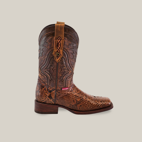 Side view of the Exotic Python - Brown - Rodeo Toe boot showcasing detailed stitching, pull tab, textured surface, and python leather accents. The Cowboy Certified tag is near the low heel.