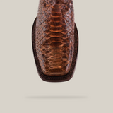 Close-up of the Exotic Python - Brown - Rodeo Toe boot, featuring a textured python leather upper in a scale-like pattern. Displayed against a neutral background, it highlights the shoes unique design and craftsmanship.